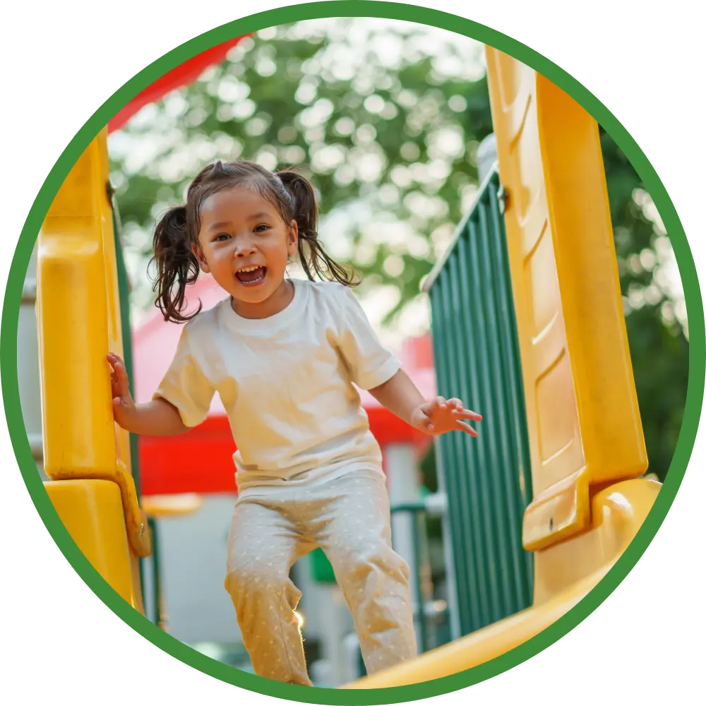 Little girl playing on playground