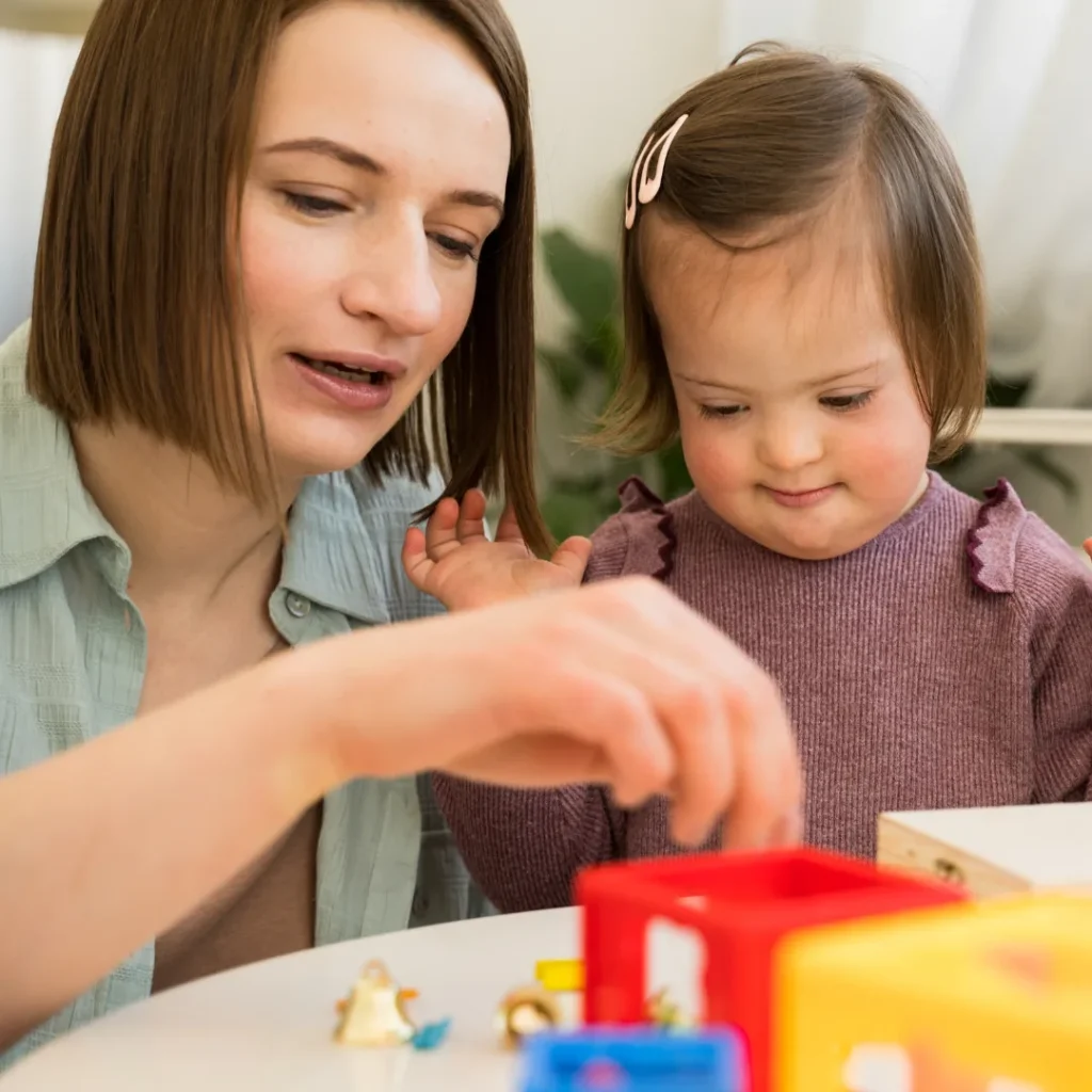 Therapist playing with disabled child
