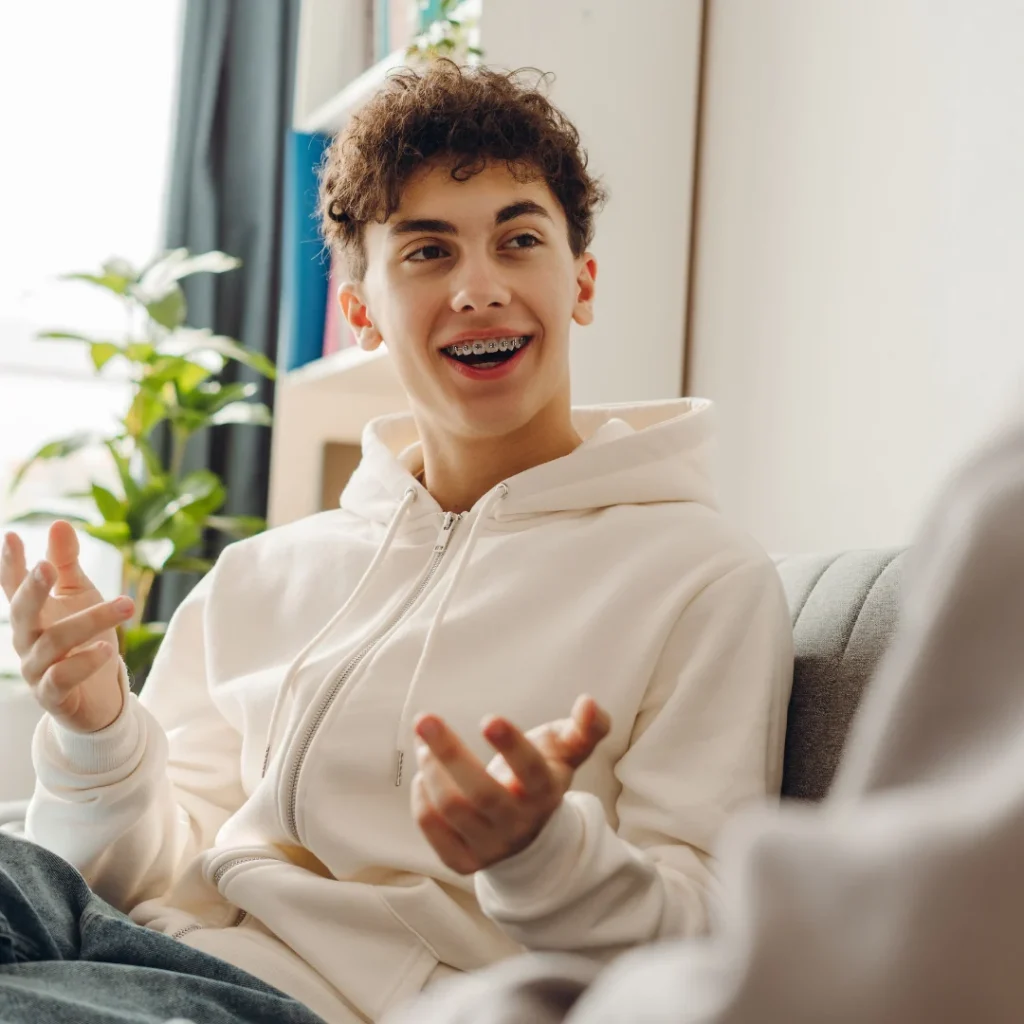 Teenage boy talking with therapist